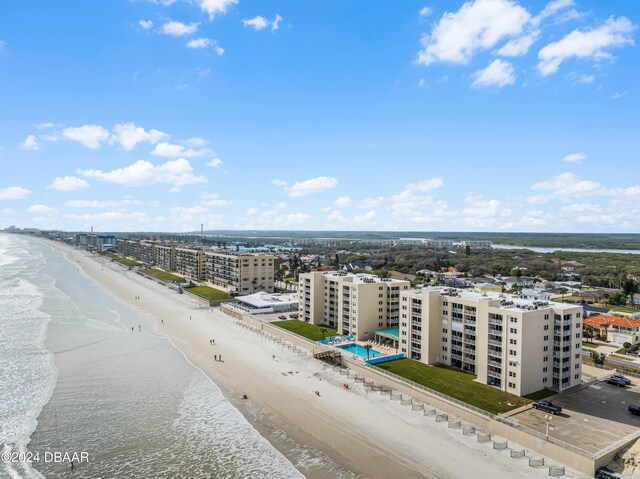 bird's eye view with a beach view and a water view