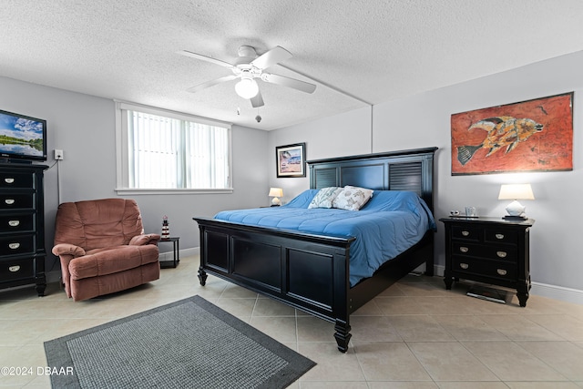 bedroom featuring light tile patterned flooring, a textured ceiling, and ceiling fan