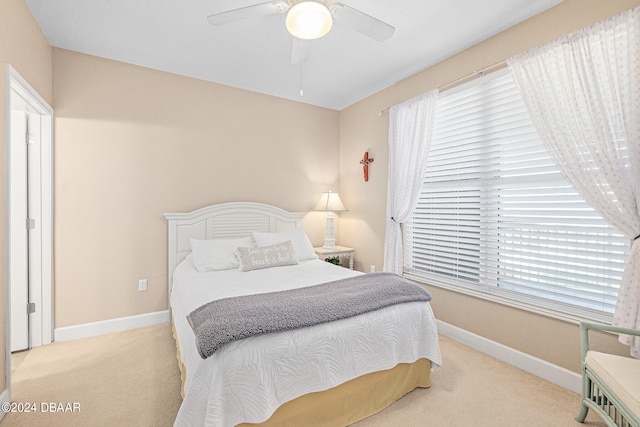 carpeted bedroom with ceiling fan