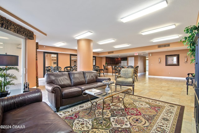 living room with decorative columns