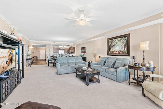 carpeted living room with ornamental molding and ceiling fan with notable chandelier