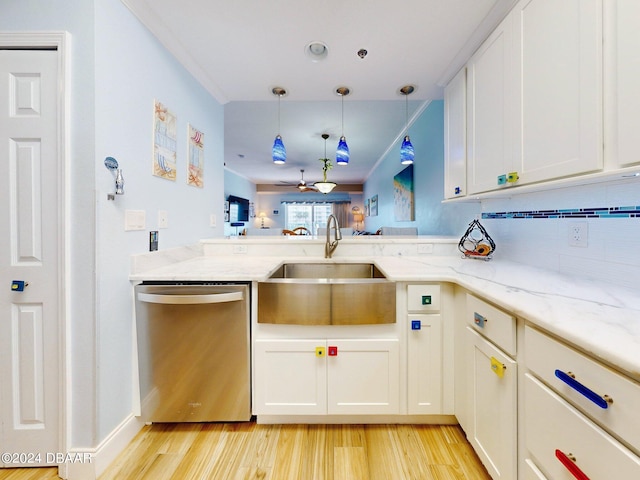 kitchen with white cabinetry, sink, light stone countertops, stainless steel dishwasher, and light wood-type flooring