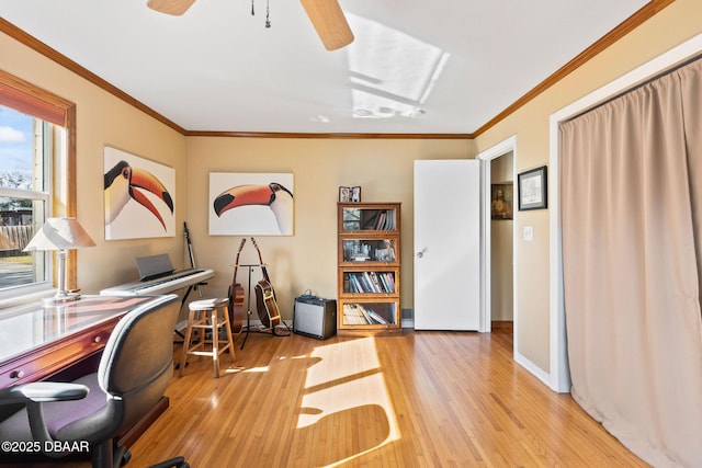 office with ceiling fan, ornamental molding, and wood-type flooring