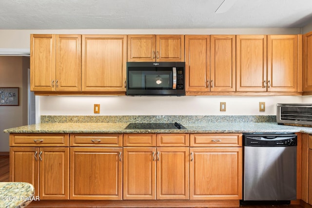 kitchen with black electric stovetop, light stone countertops, and dishwasher