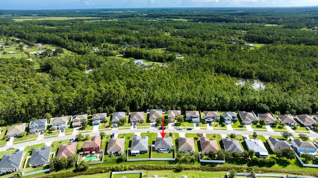 aerial view with a residential view and a wooded view