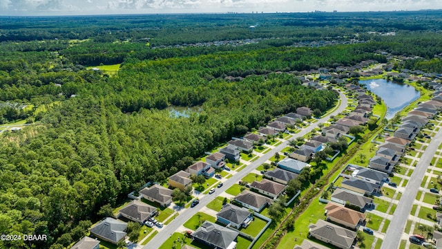 bird's eye view featuring a residential view, a water view, and a forest view