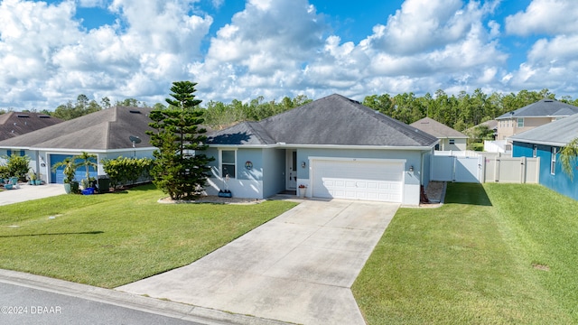 ranch-style house with a front lawn and a garage