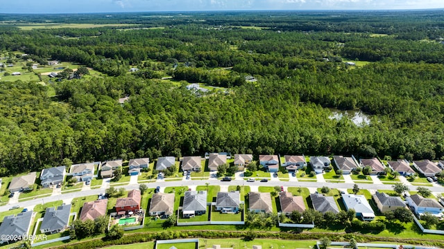 aerial view with a residential view and a view of trees