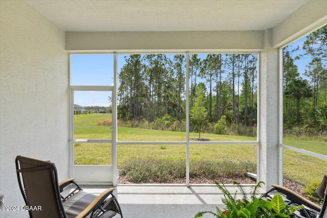 unfurnished sunroom with plenty of natural light