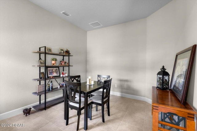 dining area with light tile patterned flooring