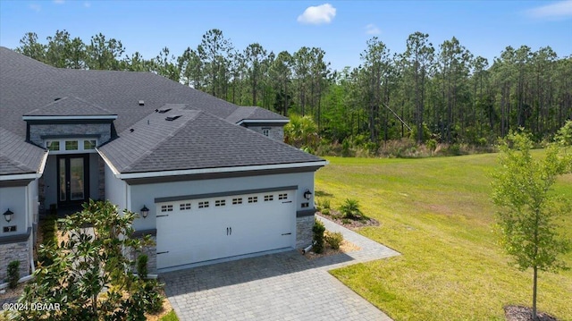 view of home's exterior with a yard and a garage