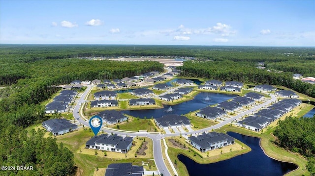 drone / aerial view with a water view