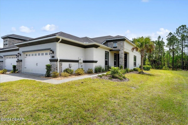 view of front of property featuring a front lawn and a garage