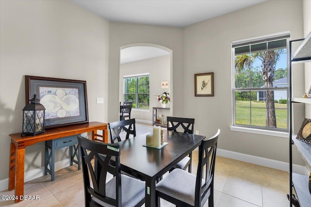 dining area featuring light tile patterned flooring