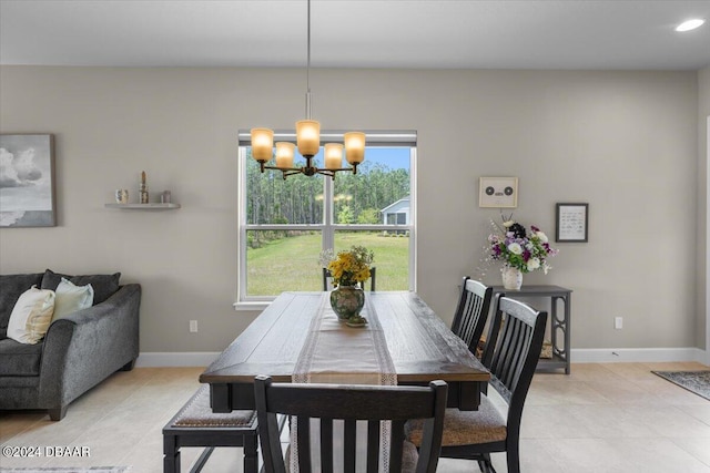 dining space with an inviting chandelier