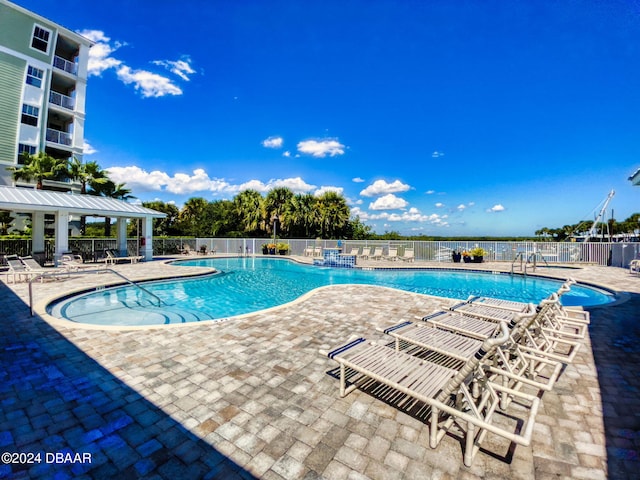 view of swimming pool featuring a patio area