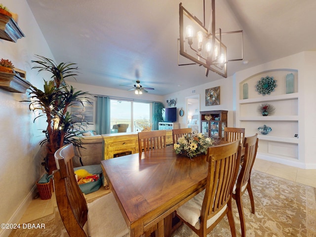 dining space featuring built in shelves, light tile patterned floors, and ceiling fan with notable chandelier