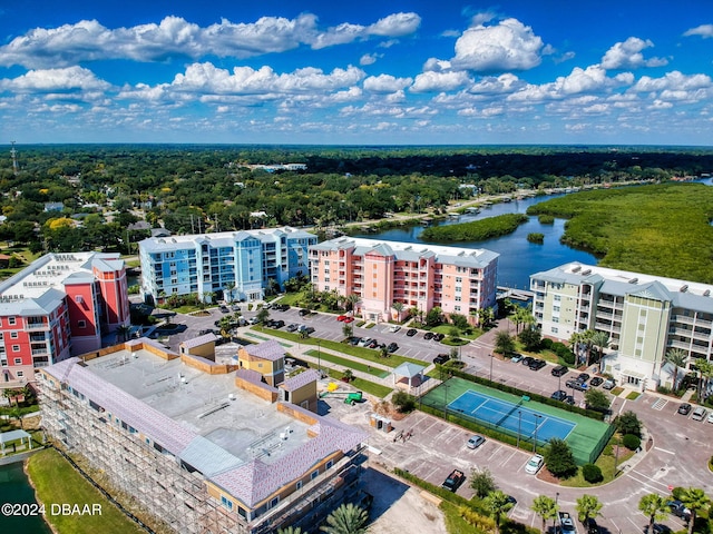 birds eye view of property with a water view