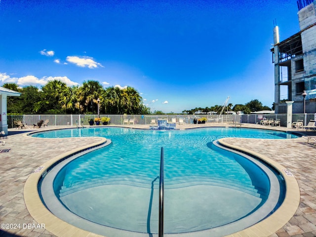 view of swimming pool with a patio