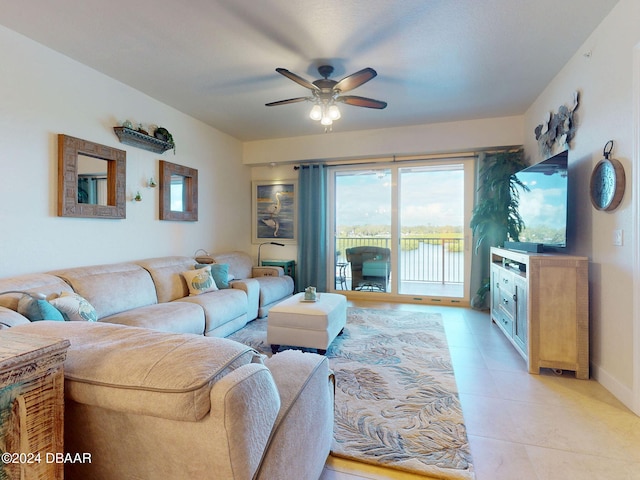 living room featuring ceiling fan and light tile patterned floors