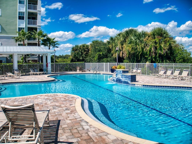 view of swimming pool featuring a patio area