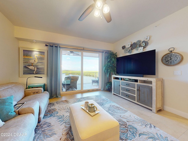 tiled living room with ceiling fan