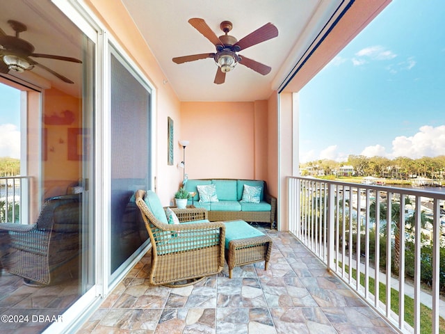 balcony with an outdoor hangout area and ceiling fan