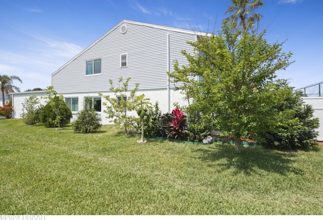 view of side of home featuring a yard