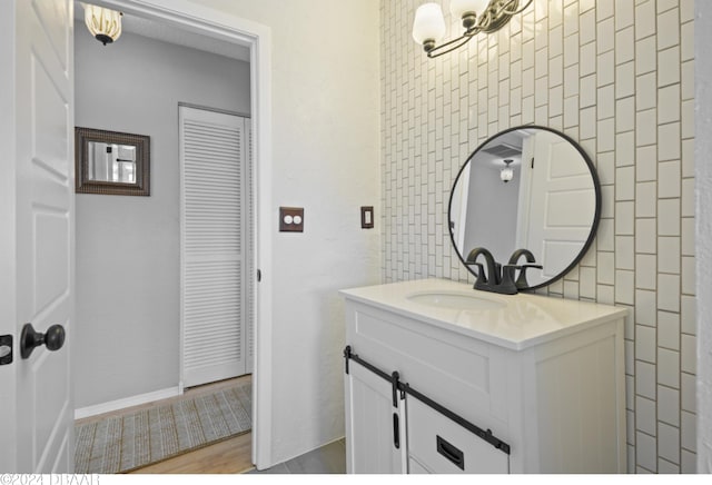 bathroom featuring wood-type flooring and vanity