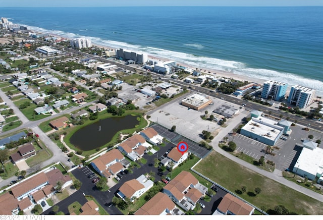 aerial view with a view of the beach and a water view