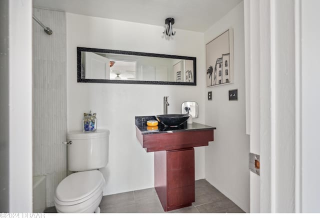 full bathroom with shower / bathtub combination, tile patterned flooring, sink, and toilet