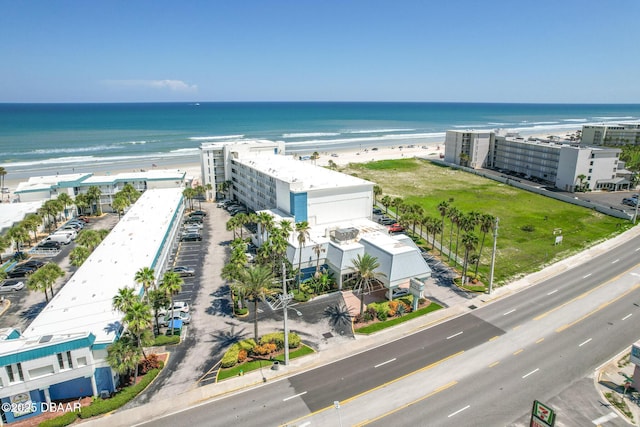 bird's eye view with a water view and a view of the beach