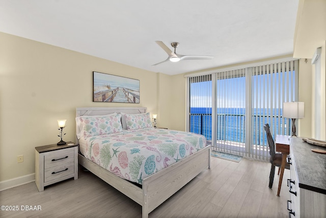 bedroom featuring light wood finished floors, access to outside, baseboards, and ceiling fan