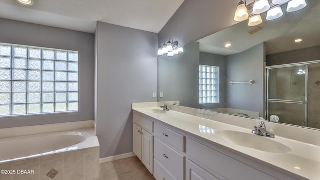 bathroom featuring tile patterned flooring, vanity, and independent shower and bath