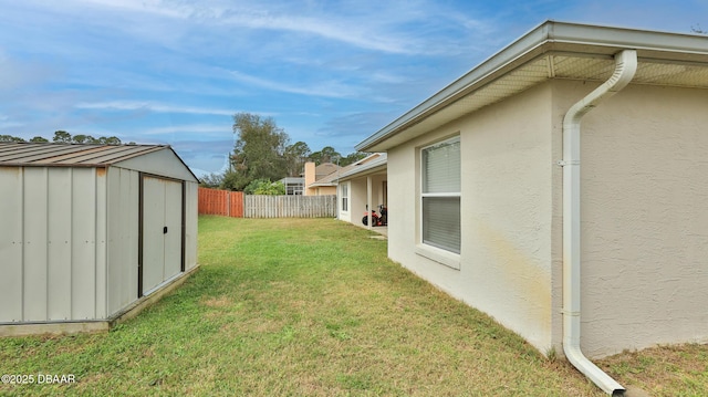 view of yard with a storage shed