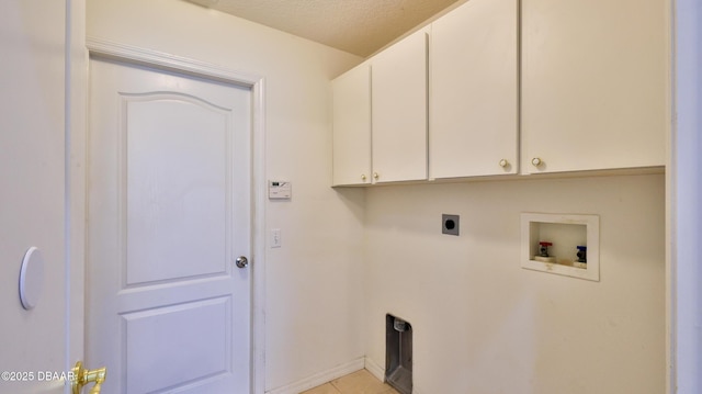 laundry room with cabinets, a textured ceiling, light tile patterned floors, washer hookup, and hookup for an electric dryer