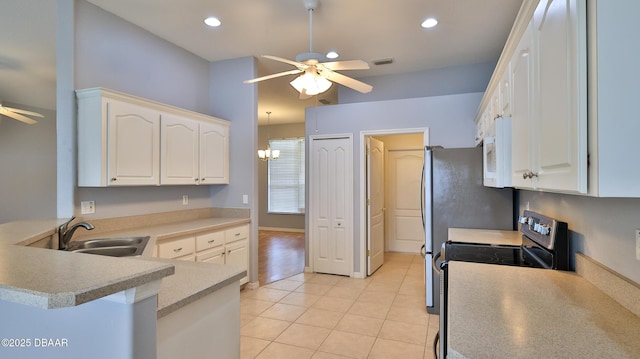 kitchen with white cabinetry, ceiling fan, kitchen peninsula, and electric stove