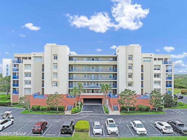 5300 S Atlantic Ave Unit 6-301, New Smyrna Beach, FL 32169 - view of apartment building / complex with uncovered parking