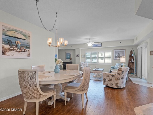 5300 S Atlantic Ave Unit 6-301, New Smyrna Beach, FL 32169 - dining room featuring hardwood / wood-style flooring, a chandelier, ceiling fan, and baseboards