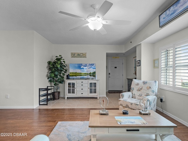 5300 S Atlantic Ave Unit 6-301, New Smyrna Beach, FL 32169 - living room with wood finished floors, ceiling fan, and baseboards