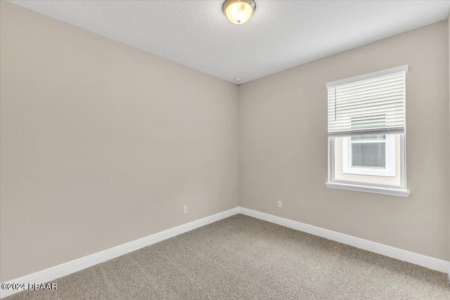 3116 Legends Preserve Dr, Daytona Beach, FL 32124 - unfurnished room with carpet and baseboards
