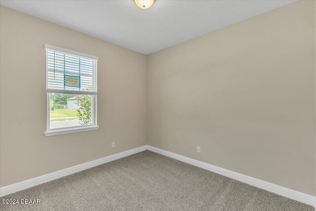 3116 Legends Preserve Dr, Daytona Beach, FL 32124 - unfurnished room featuring carpet and baseboards