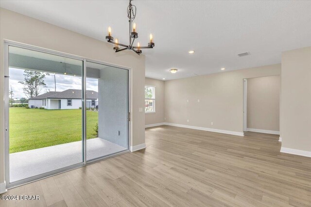3116 Legends Preserve Dr, Daytona Beach, FL 32124 - unfurnished room with a chandelier, light wood finished floors, baseboards, and recessed lighting