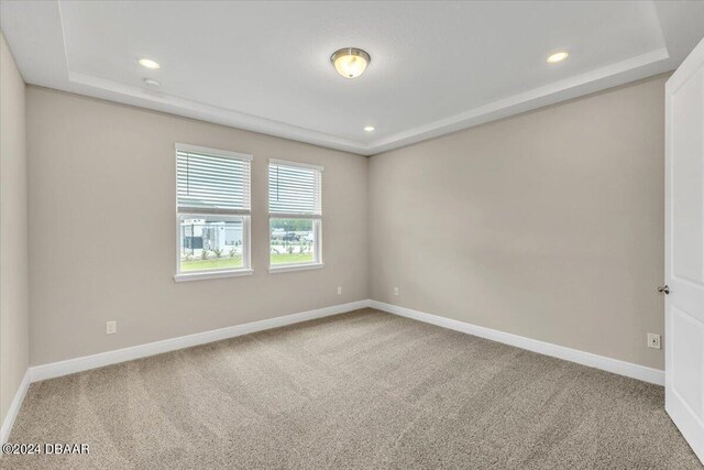3116 Legends Preserve Dr, Daytona Beach, FL 32124 - carpeted empty room with a raised ceiling, baseboards, and recessed lighting