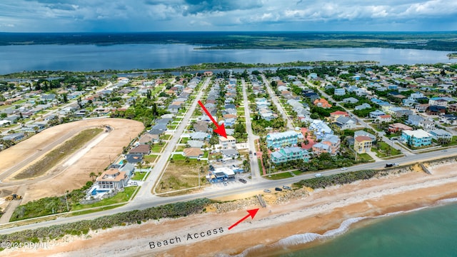 bird's eye view with a view of the beach and a water view