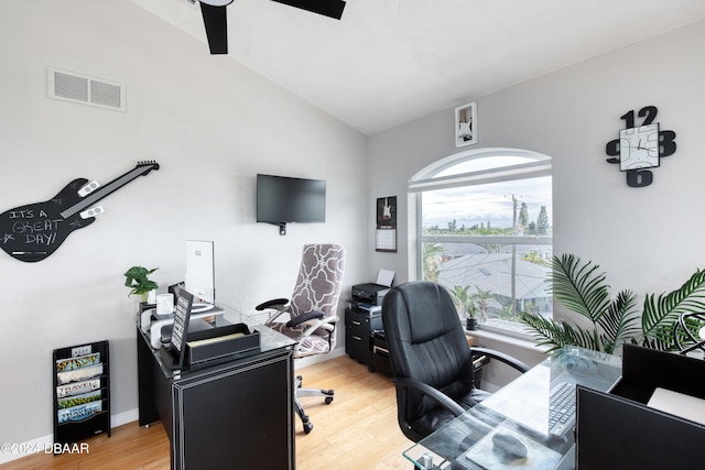 office area with ceiling fan, hardwood / wood-style floors, and vaulted ceiling