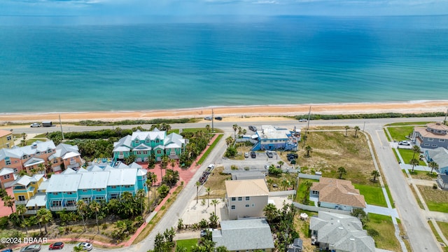 drone / aerial view with a view of the beach and a water view