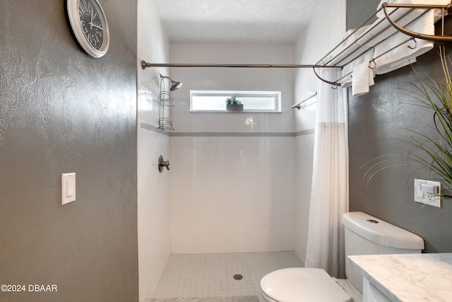 bathroom featuring vanity, toilet, and walk in shower