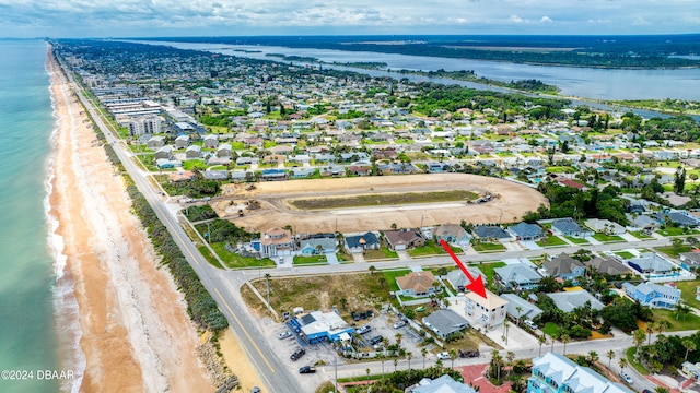 aerial view with a beach view and a water view