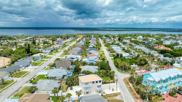 drone / aerial view with a water view